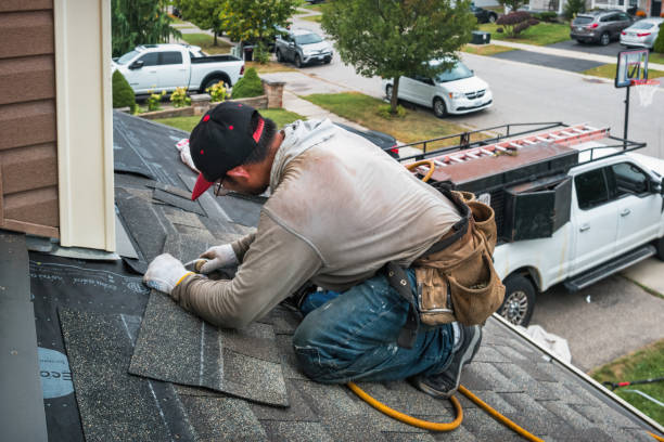 Professional Roofing technician working in Kendall, NY